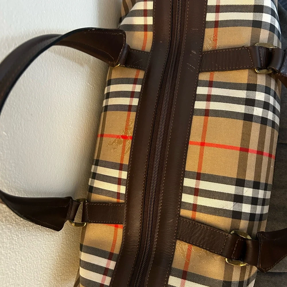 Burberrys Haymarket Boston Tan Duffel with Brown Leather Trim 10H x 19W inches